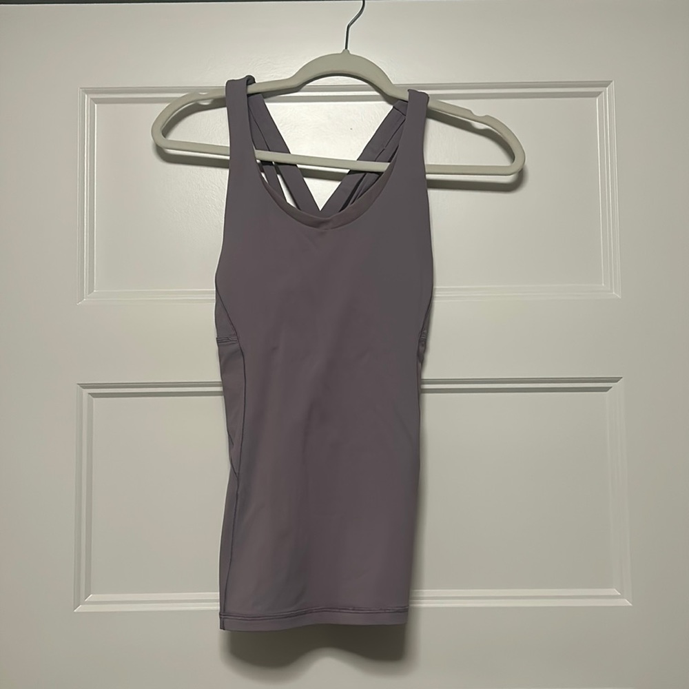 Purple tank. Waist length. Built in bra.